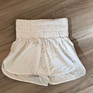 FP Movement by Free People Ivory Smocked High-Waist “The way home run shorts”